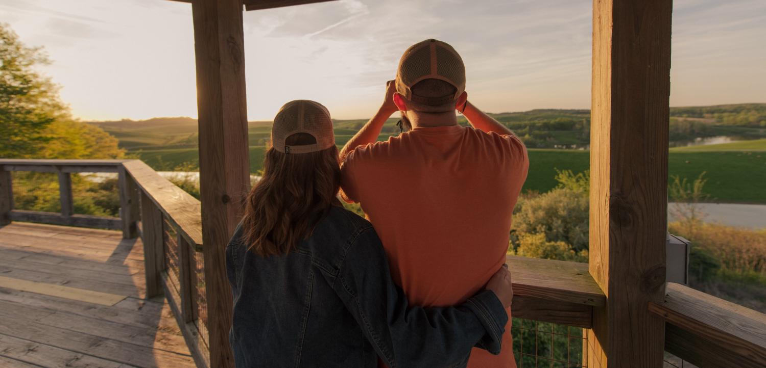 man and woman on outlook deck