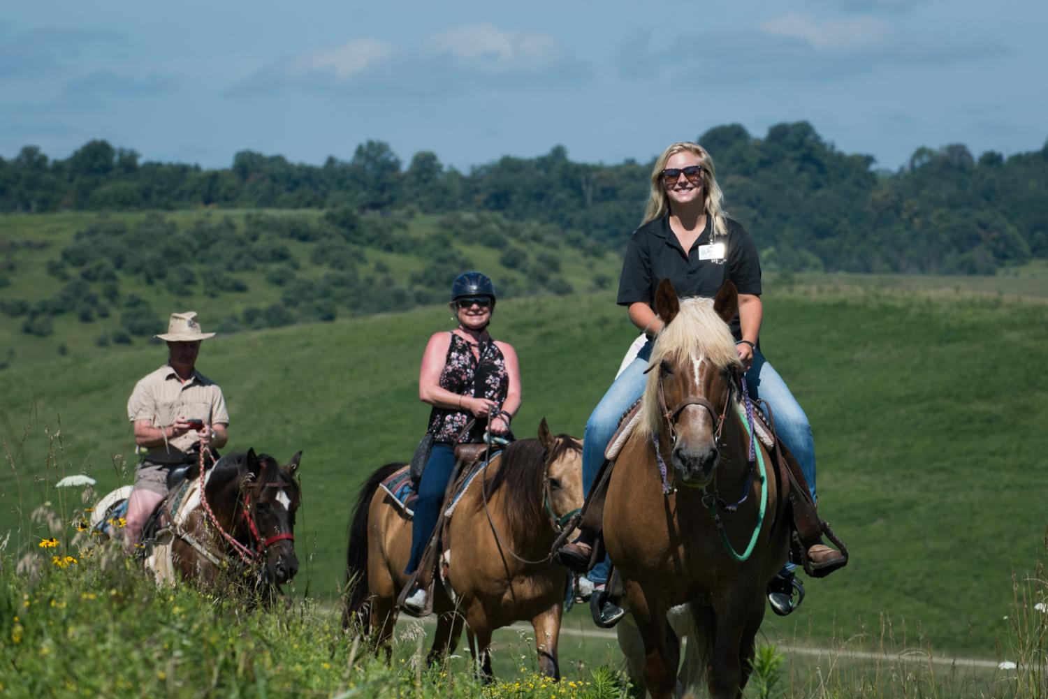 horseback riders smiling