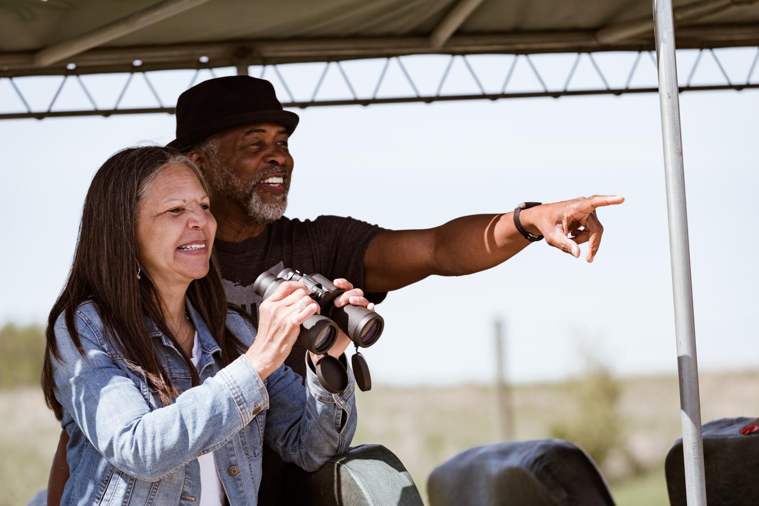 two people with binoculars