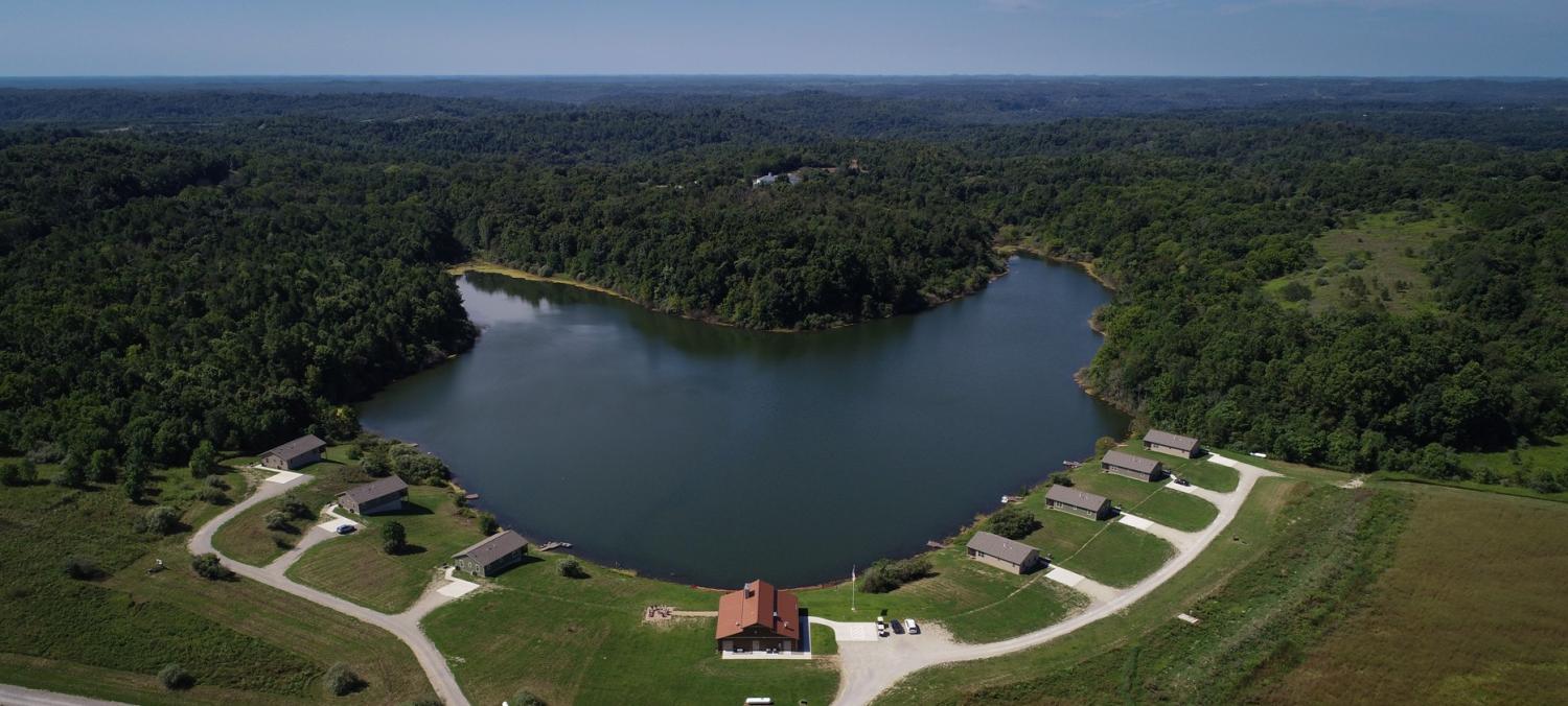 aerial view of cabins on lake