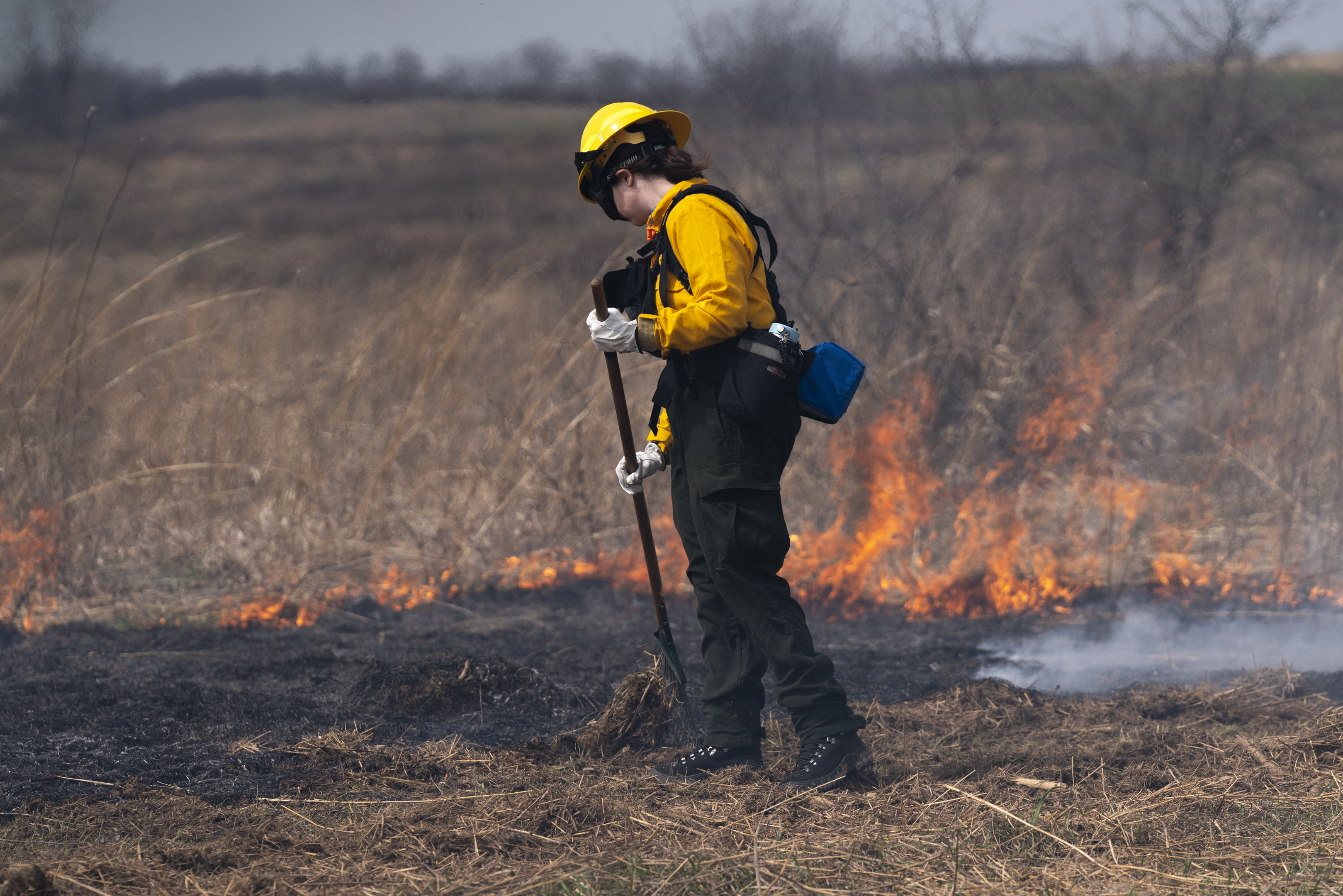 firefighter in burning prairie