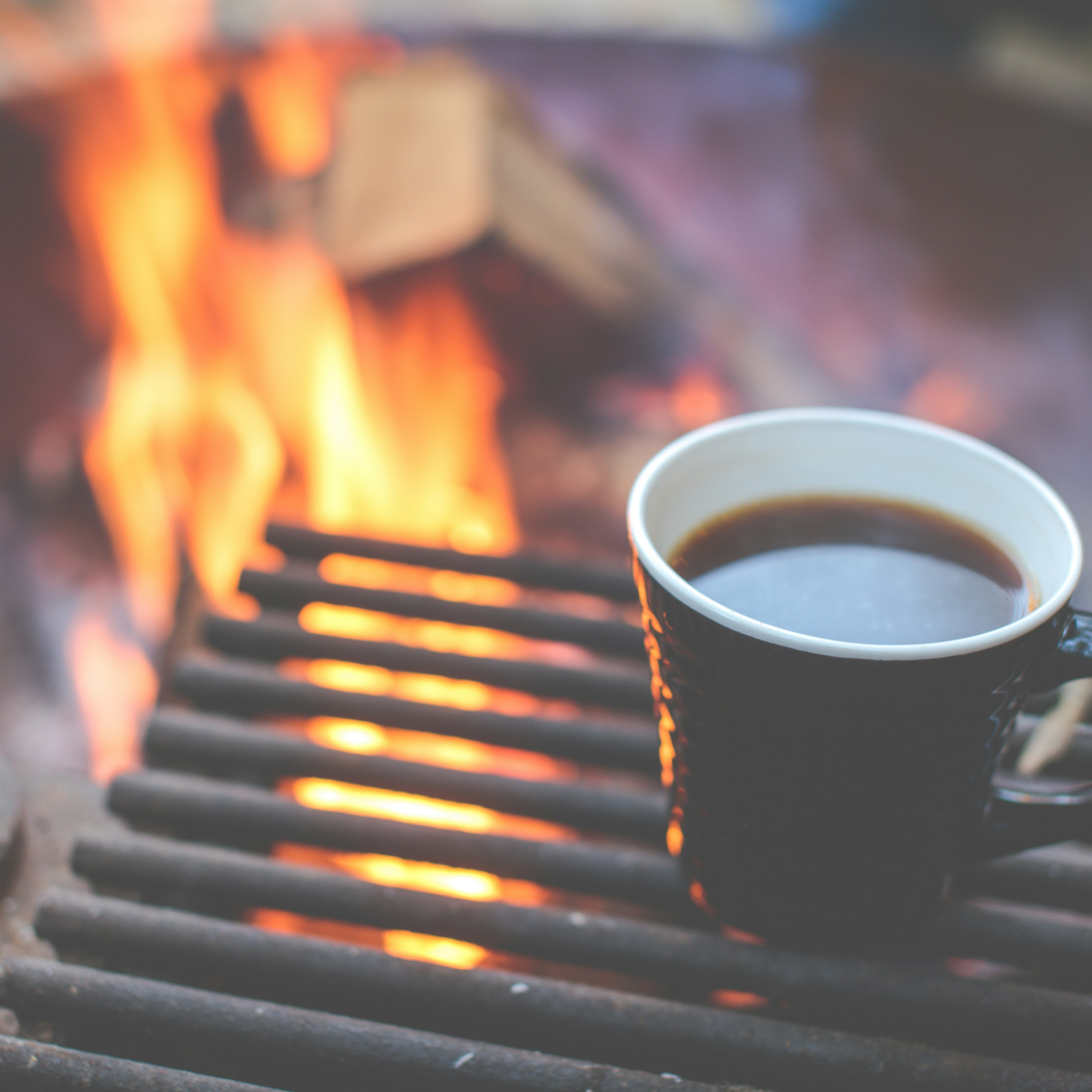 coffee mug on fire grate