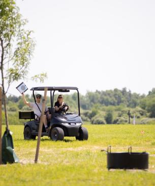 camp staff on golf cart