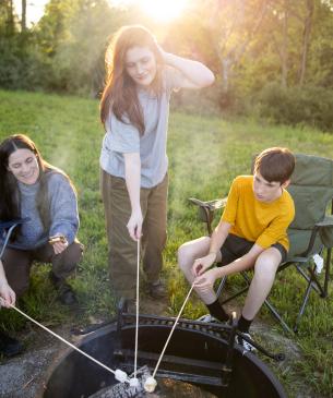 group of people making s'mores