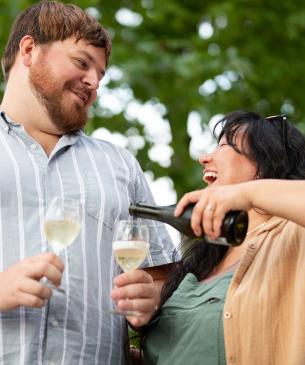Couple with champagne at Yurts