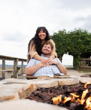 two individuals enjoying fire