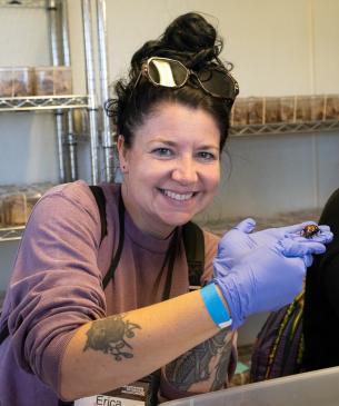 woman holding beetle