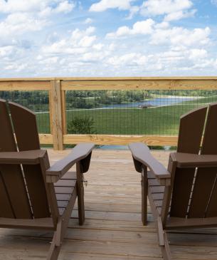 adirondack chairs on wooden deck