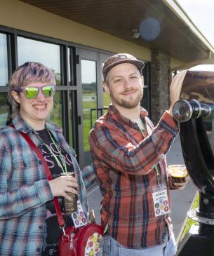 event guests posing for photo with view finder